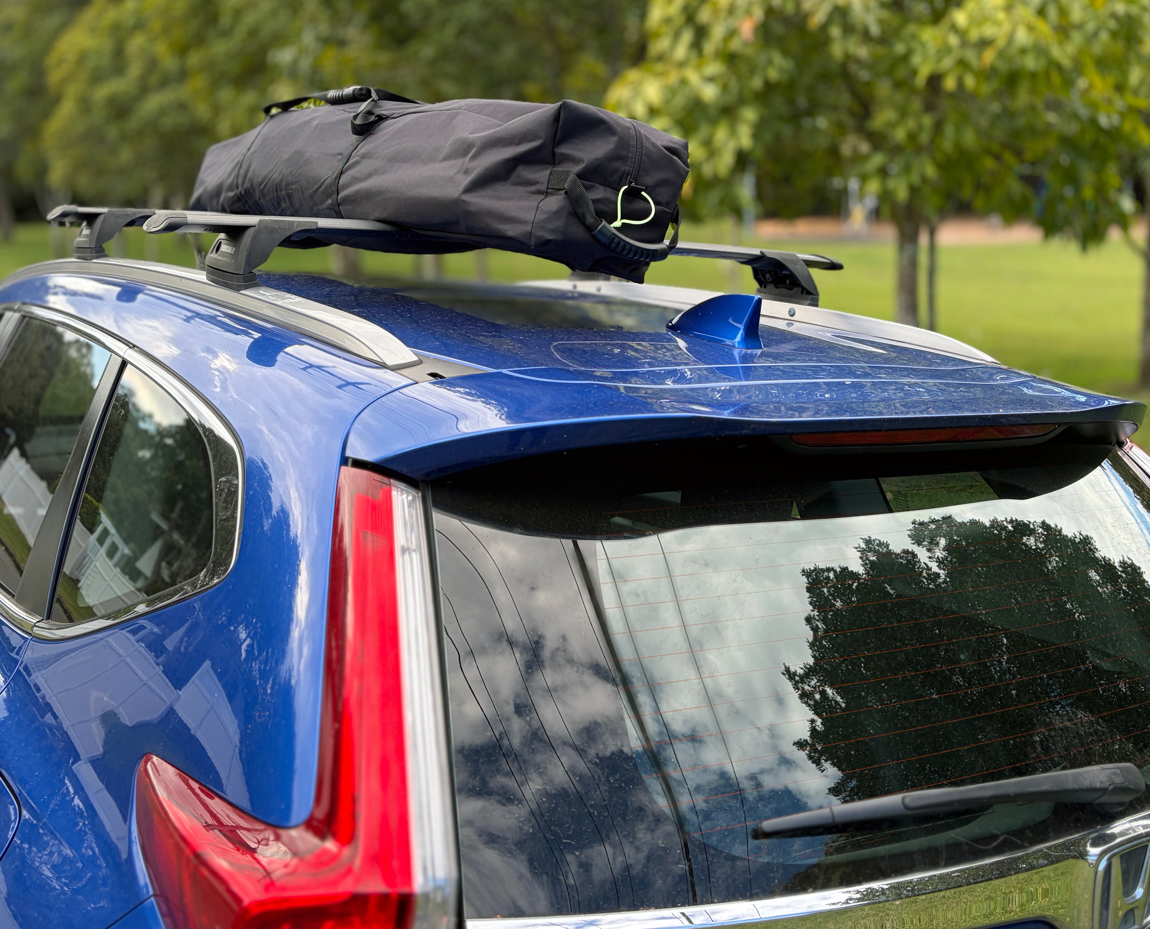 RapidPack pop up tent bag has handles at both ends to make it easy for two people to carry.