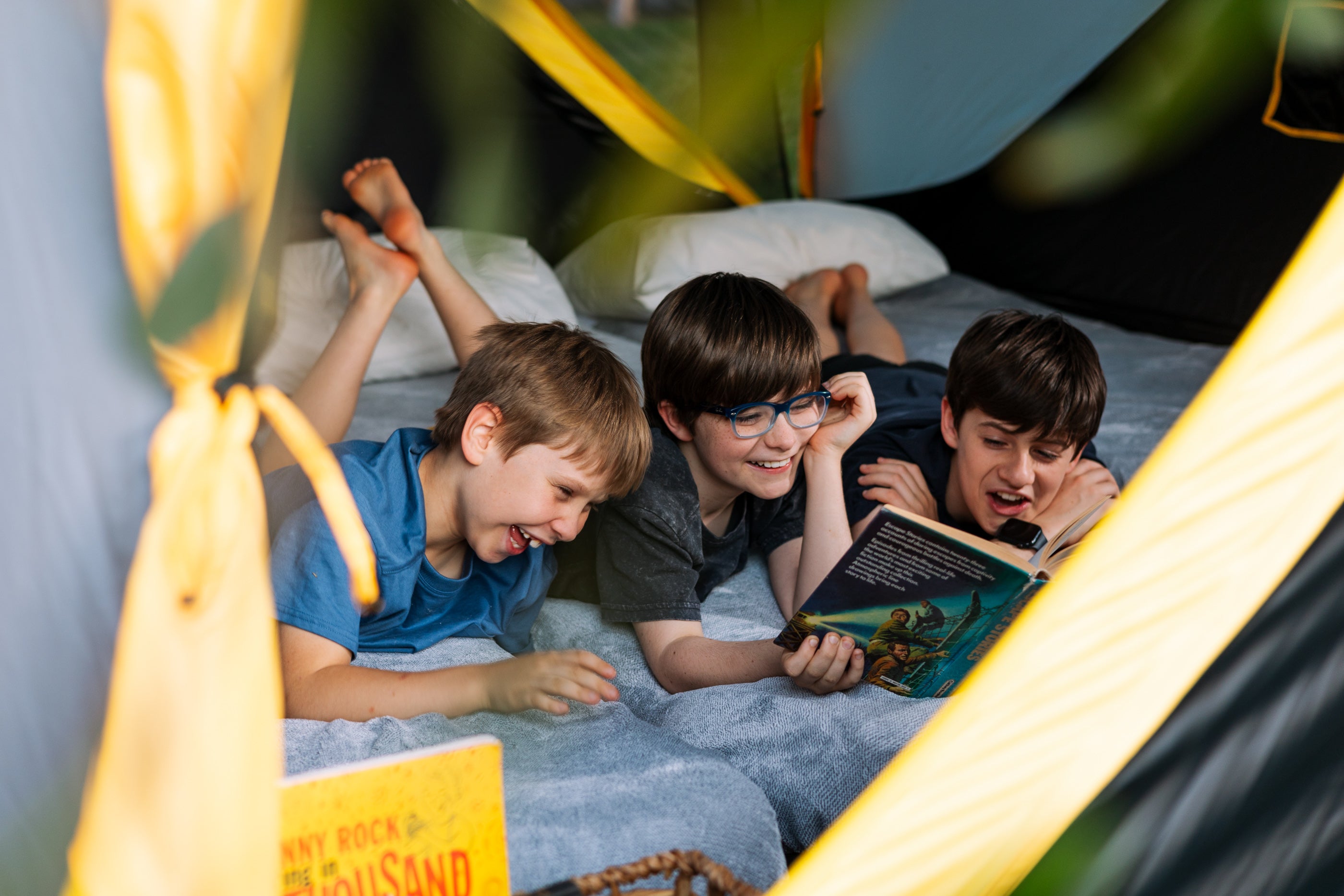 Kids reading in pop up tent