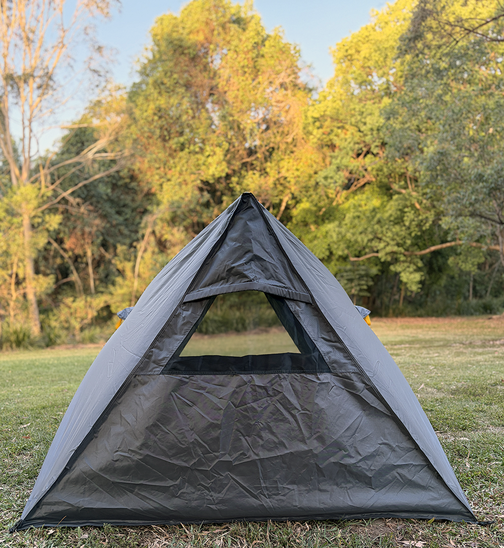 Pop-up style swag tent. Window end.