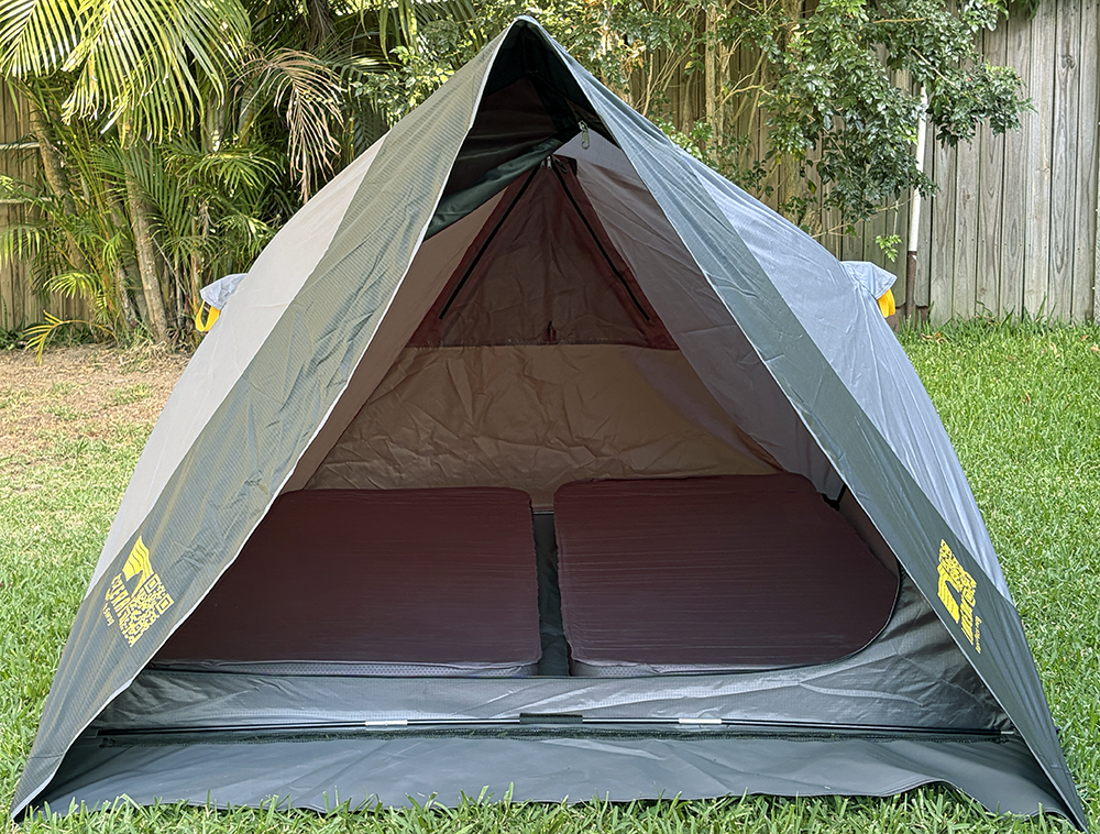 Pop-up style swag tent with two full sized single mattresses inside