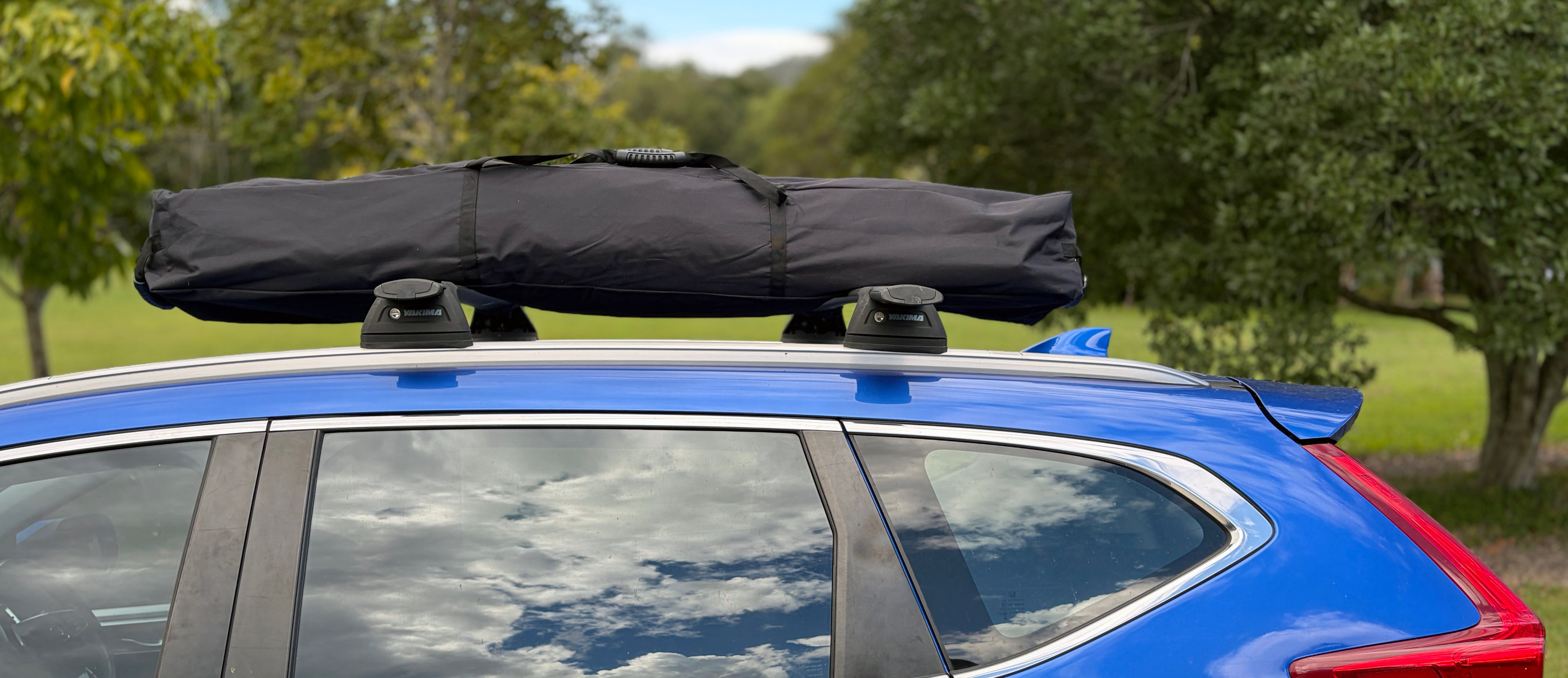RapidPack pop up tent bag can be strapped to the roof rack. Because it is fully waterproof your tent will be dry when you get to the campsite.
